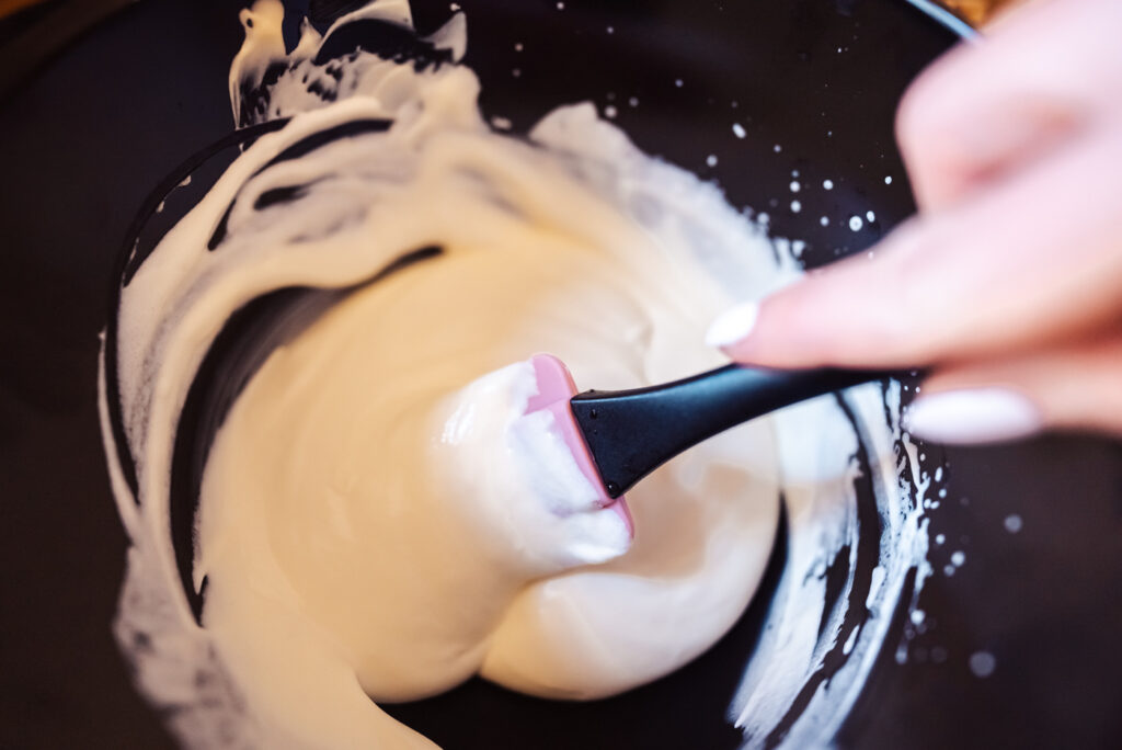 mixing whipped cream and mayonnaise for waldorf salad dressing